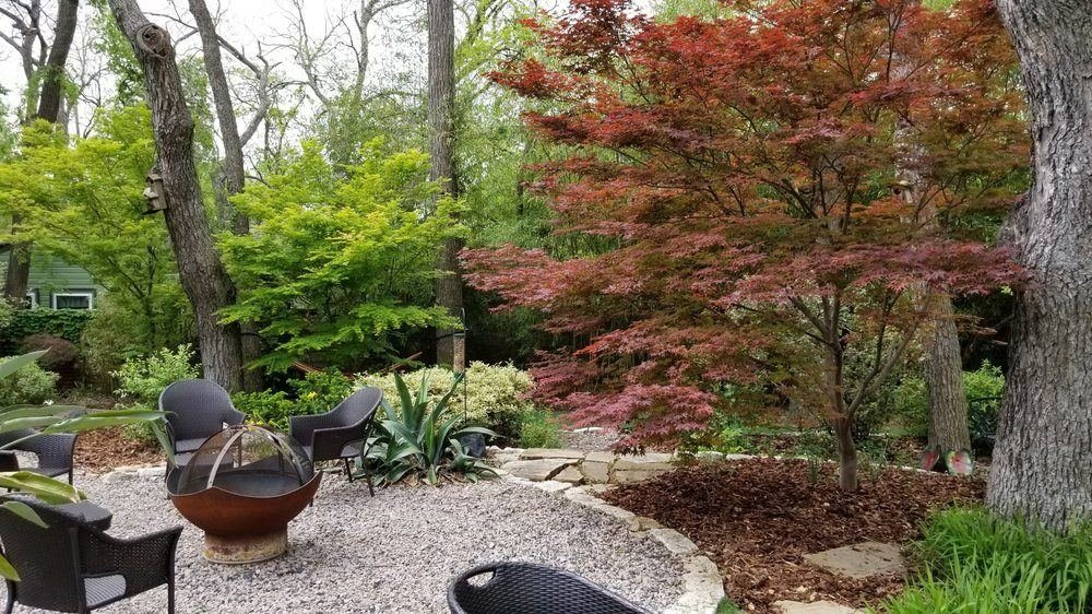 Designed residential backyard patio and fire pit outdoor living space